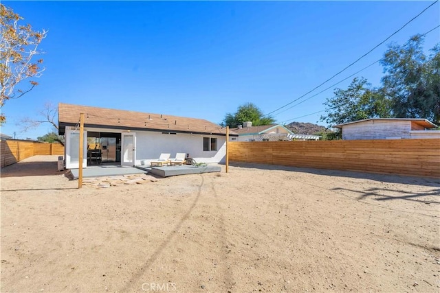 62044 Valley View Cir, Joshua Tree, CA 92252 - back of property featuring a patio area, a fenced backyard, and stucco siding