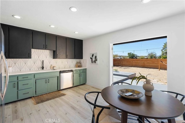 62044 Valley View Cir, Joshua Tree, CA 92252 - kitchen with stainless steel dishwasher, green cabinetry, tasteful backsplash, light countertops, and recessed lighting