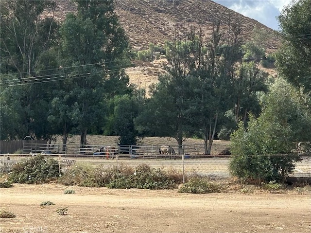 view of mountain feature with a rural view