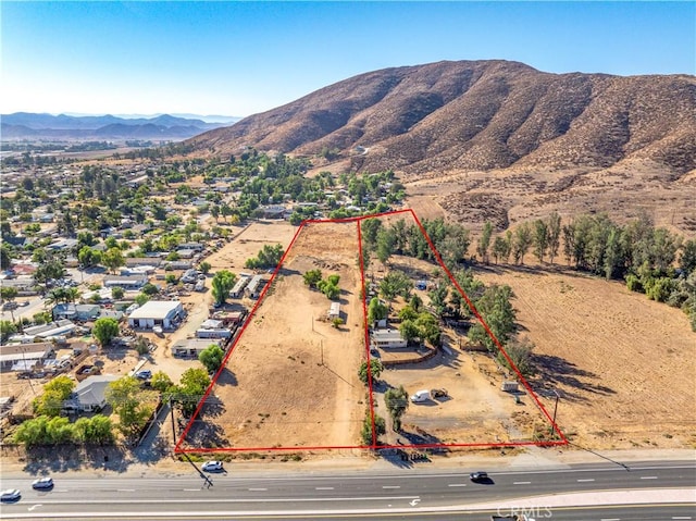 drone / aerial view featuring a mountain view