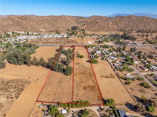 birds eye view of property featuring a mountain view