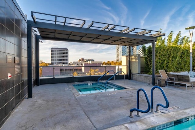 view of swimming pool with a pergola, a hot tub, and a patio area