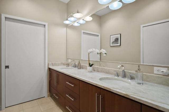 bathroom featuring tile patterned flooring and vanity