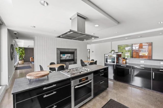 kitchen with a center island, island exhaust hood, and stainless steel appliances