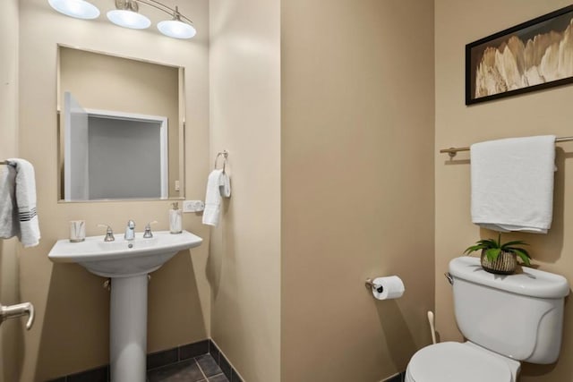 bathroom featuring tile patterned floors and toilet