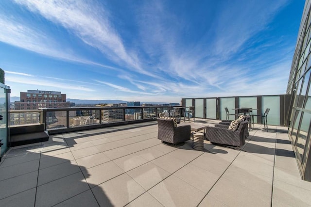 view of patio / terrace featuring a mountain view and an outdoor living space