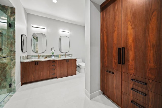 bathroom featuring vanity, toilet, and walk in shower