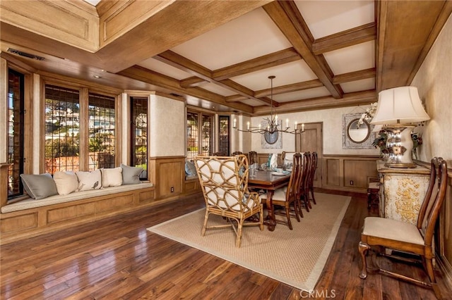 dining area with plenty of natural light, beamed ceiling, coffered ceiling, and hardwood / wood-style floors