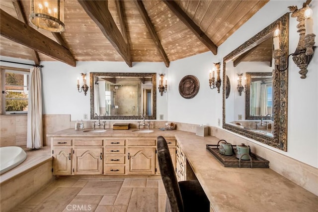 bathroom featuring lofted ceiling with beams, wood ceiling, double vanity, and a sink