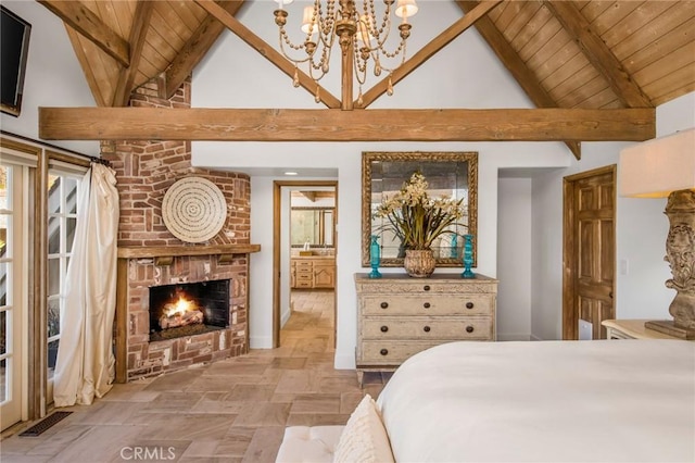 bedroom with wooden ceiling, connected bathroom, a brick fireplace, high vaulted ceiling, and beam ceiling