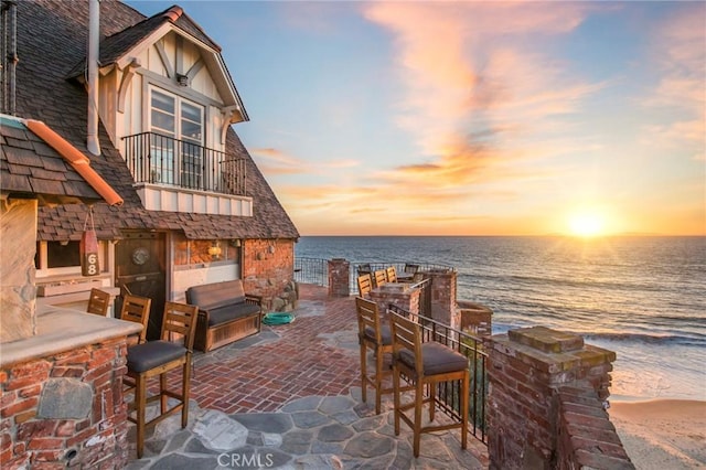 view of patio / terrace featuring a water view