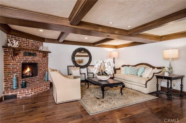 living room with coffered ceiling, a brick fireplace, dark hardwood / wood-style floors, and beam ceiling