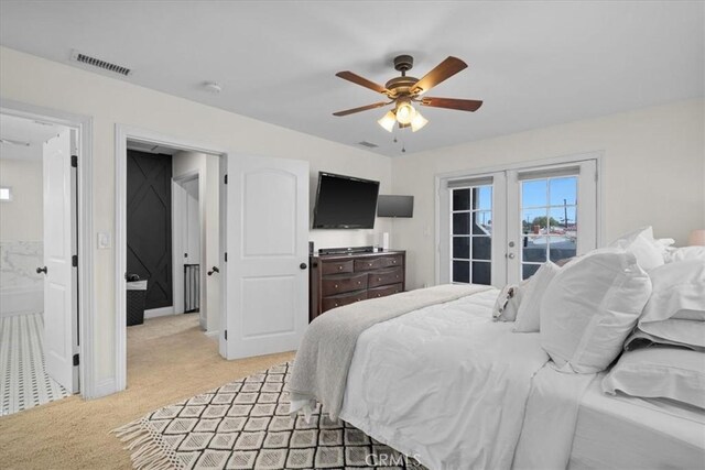 carpeted bedroom with french doors, access to outside, ceiling fan, and ensuite bathroom