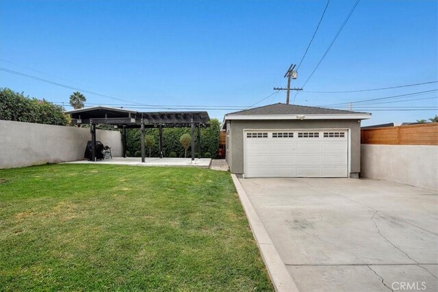 garage featuring a lawn