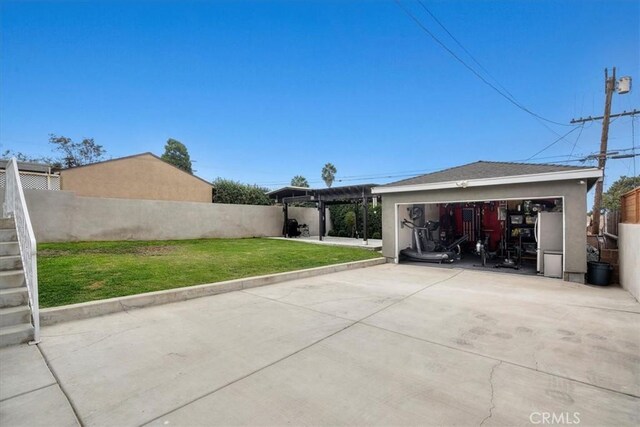 view of patio with a garage and a pergola