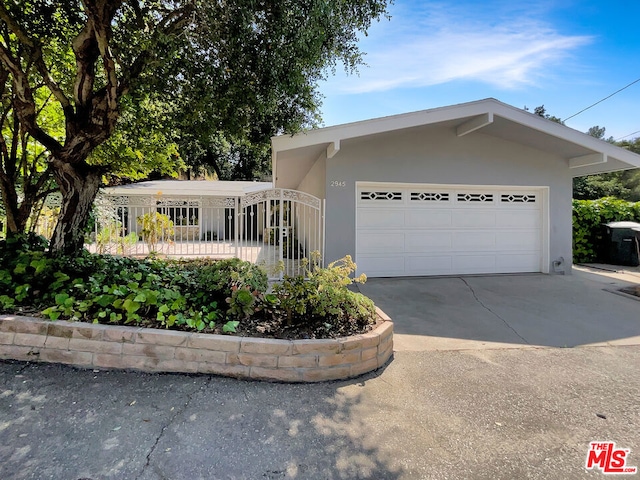 single story home featuring a garage