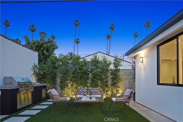 view of patio terrace at dusk