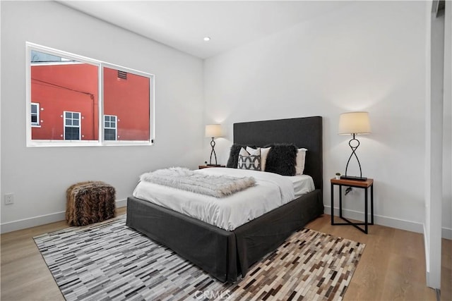 bedroom featuring wood-type flooring