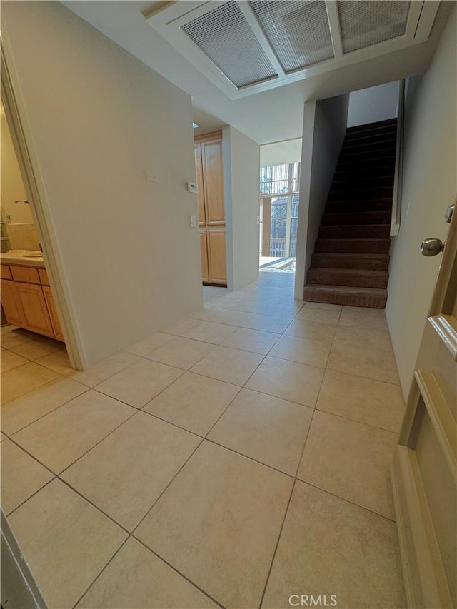 hallway featuring light tile patterned flooring