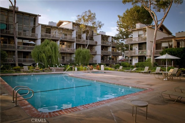 view of swimming pool featuring a patio