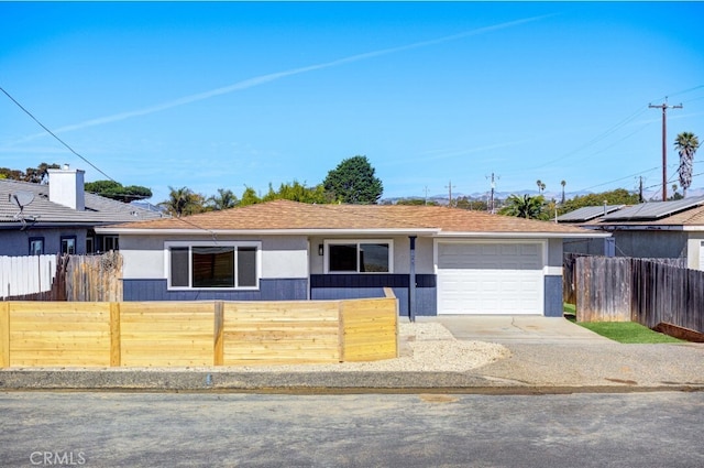 ranch-style home featuring a garage