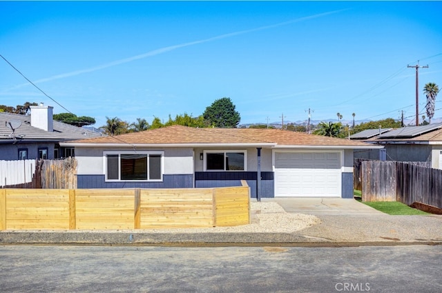 ranch-style house featuring a garage