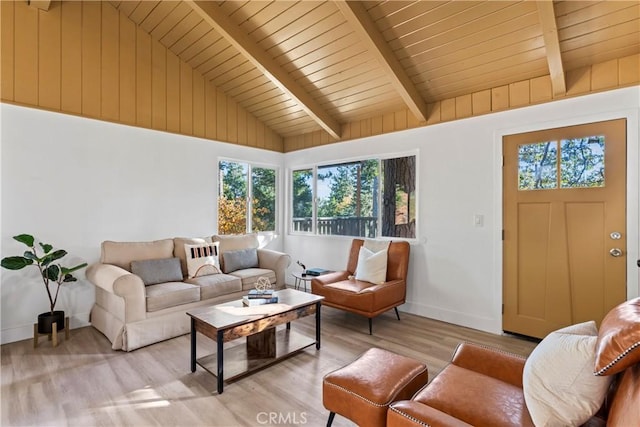 living room with light hardwood / wood-style floors, wooden ceiling, and lofted ceiling with beams