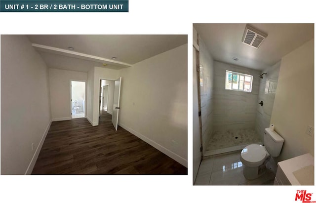 bathroom with a tile shower and toilet