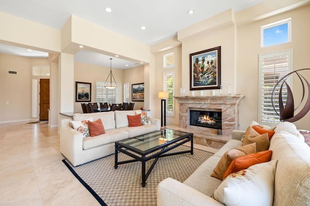 tiled living room with a premium fireplace