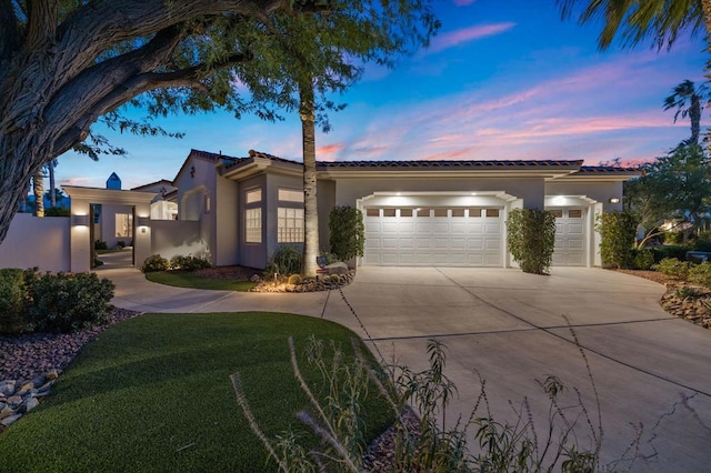 mediterranean / spanish home featuring a garage