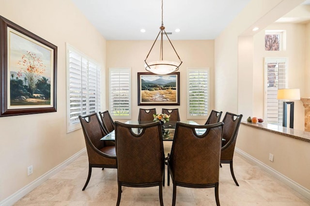 dining space featuring plenty of natural light