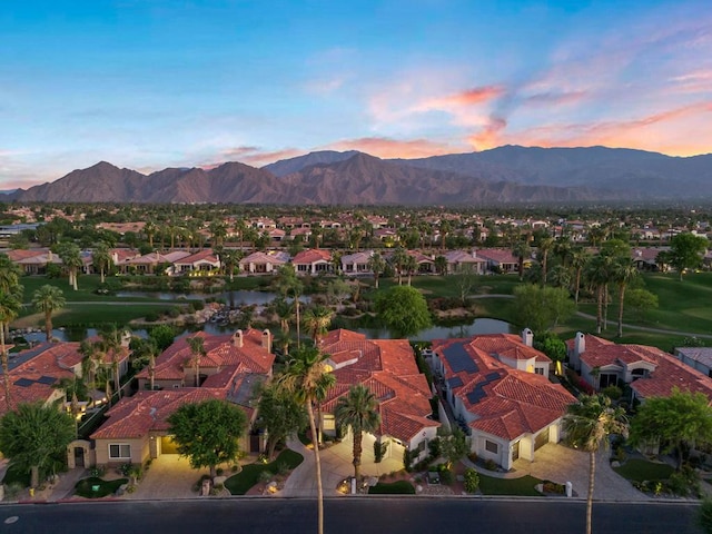 aerial view at dusk with a mountain view