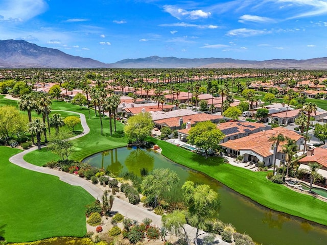 bird's eye view with a water and mountain view