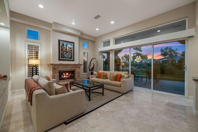 living room featuring a premium fireplace