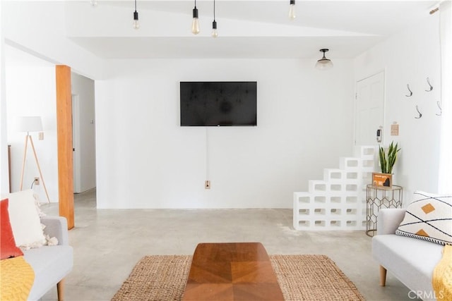 living room featuring vaulted ceiling