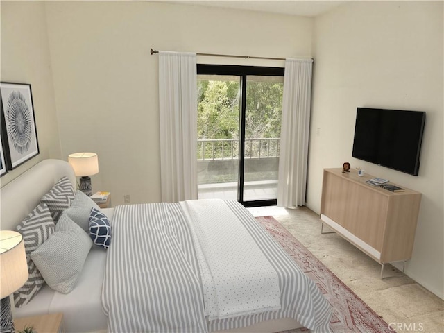 bedroom featuring access to outside and light colored carpet