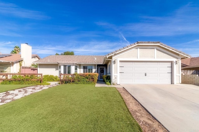 ranch-style house featuring a front yard and a garage