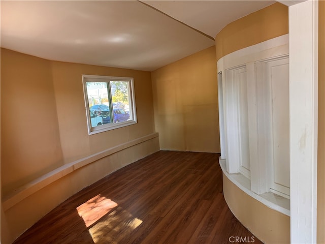 unfurnished room featuring dark hardwood / wood-style floors