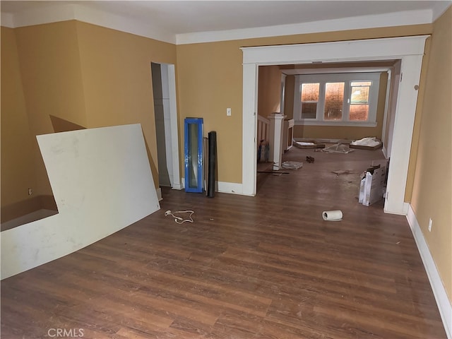 unfurnished room with dark wood-type flooring