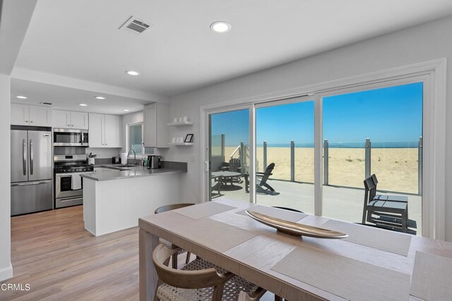 dining area featuring visible vents, recessed lighting, and light wood-style floors