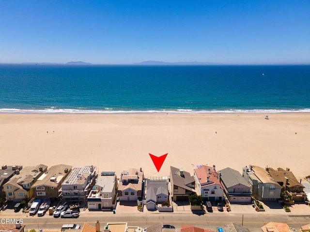 view of water feature with a view of the beach and a residential view