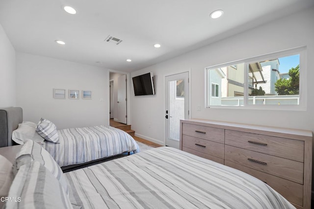 bedroom with visible vents, recessed lighting, baseboards, and access to outside