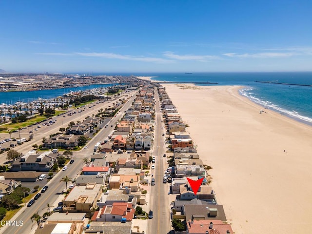 birds eye view of property featuring a view of the beach and a water view