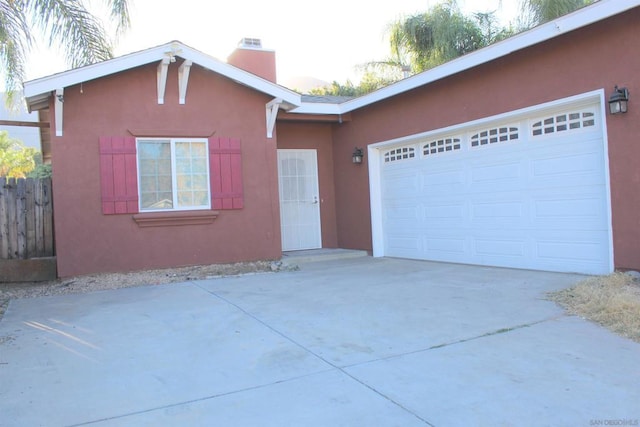 ranch-style house featuring a garage