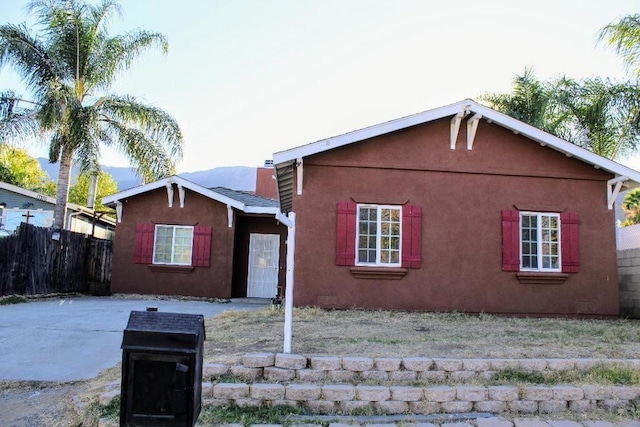 back of house with a patio