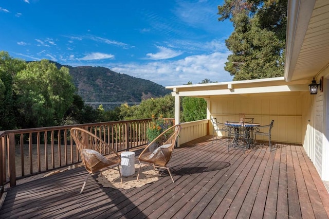 wooden deck featuring a mountain view