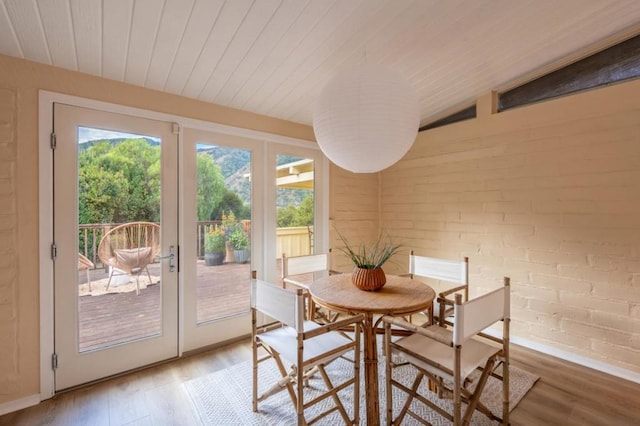 interior space with vaulted ceiling, wood ceiling, and french doors