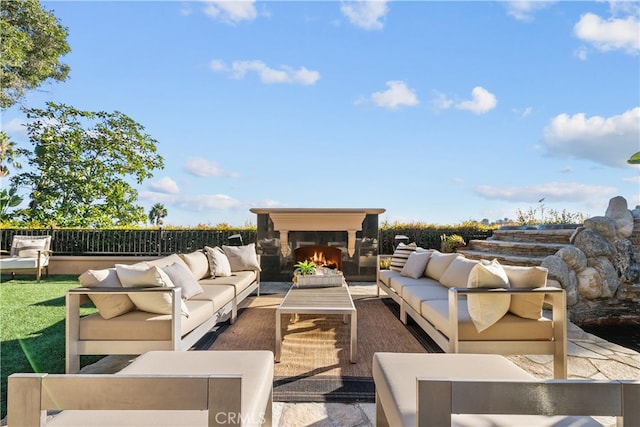 view of patio / terrace featuring an outdoor living space with a fireplace