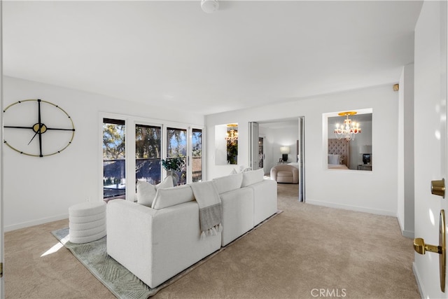 living room featuring an inviting chandelier and light colored carpet