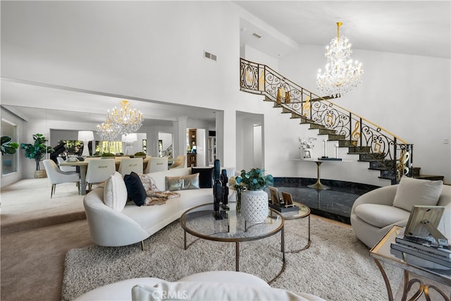 living room featuring an inviting chandelier and carpet floors